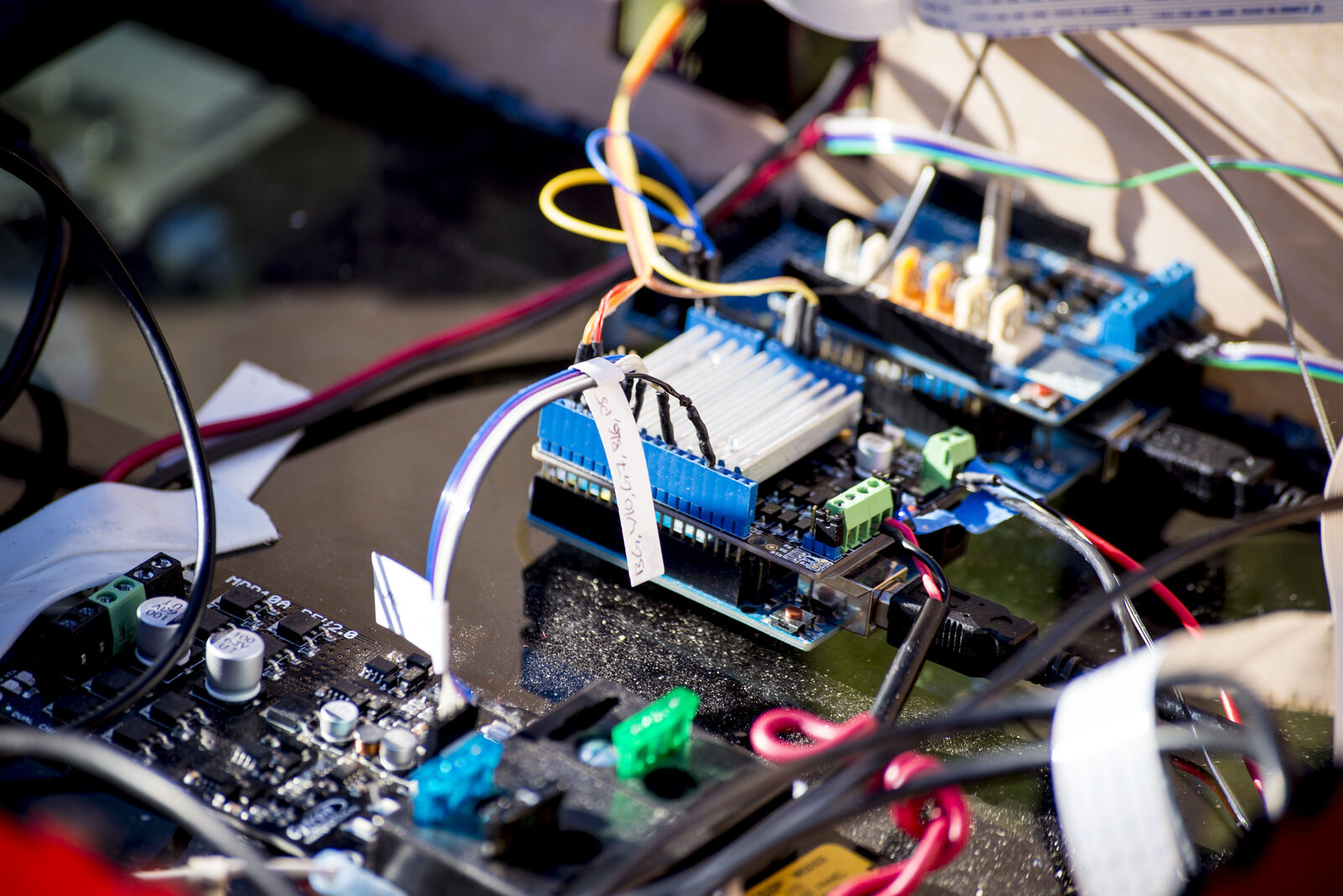A close-up of RAPID's electronics: the Arduino boards, wiring, and connectors I built for the robot.
